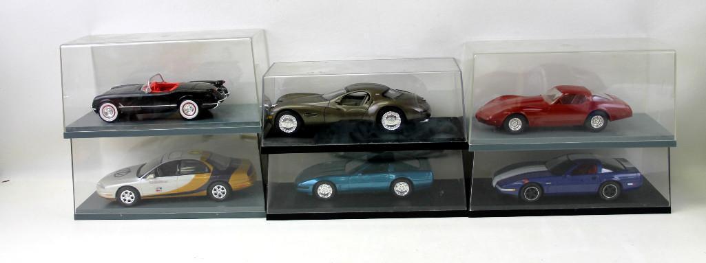 Six Plastic Model Cars in Display Cases (1 of 4)