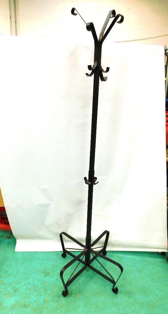 Abstract Metal Coat Rack: Abstract metal coat rack with different length hangers . Measures approximately 73" tall