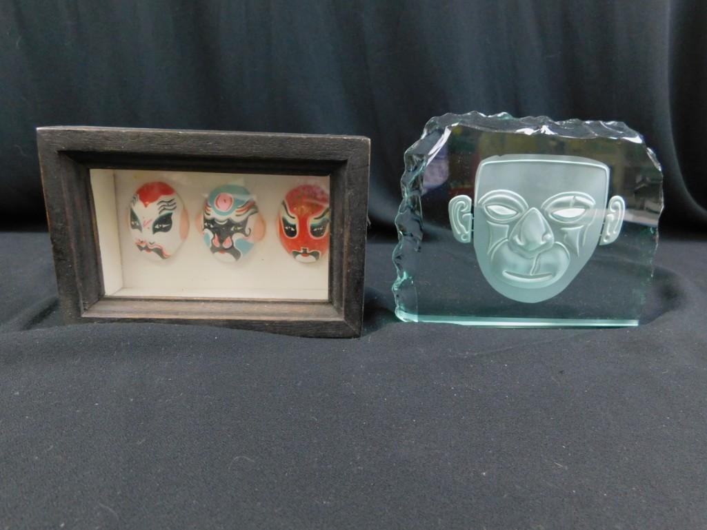 Framed decorative masks and a glass etching of a face (1 of 4)