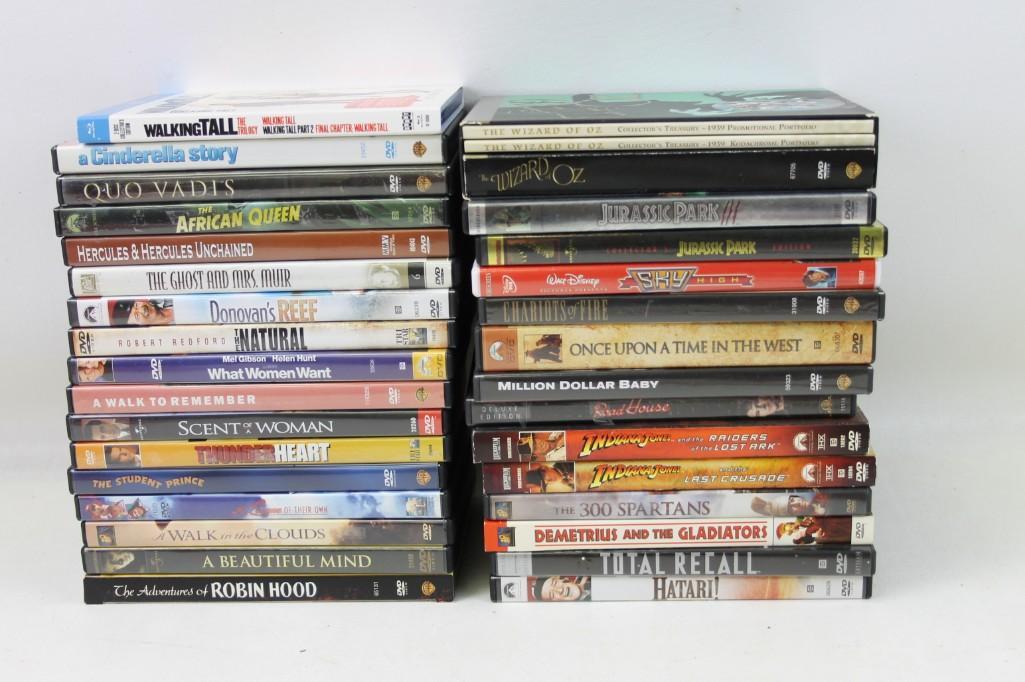Lot of roughly 31 DVDs: Lot of roughly 31 DVDs Includes Indiana Jones, The Natural, What Women Want, Robin Hood, Wizard of Oz, Jurasic Park, Walt Disney, Million Dollar Baby, Total Recall, Robin Hood, Scent of a Women and Ma