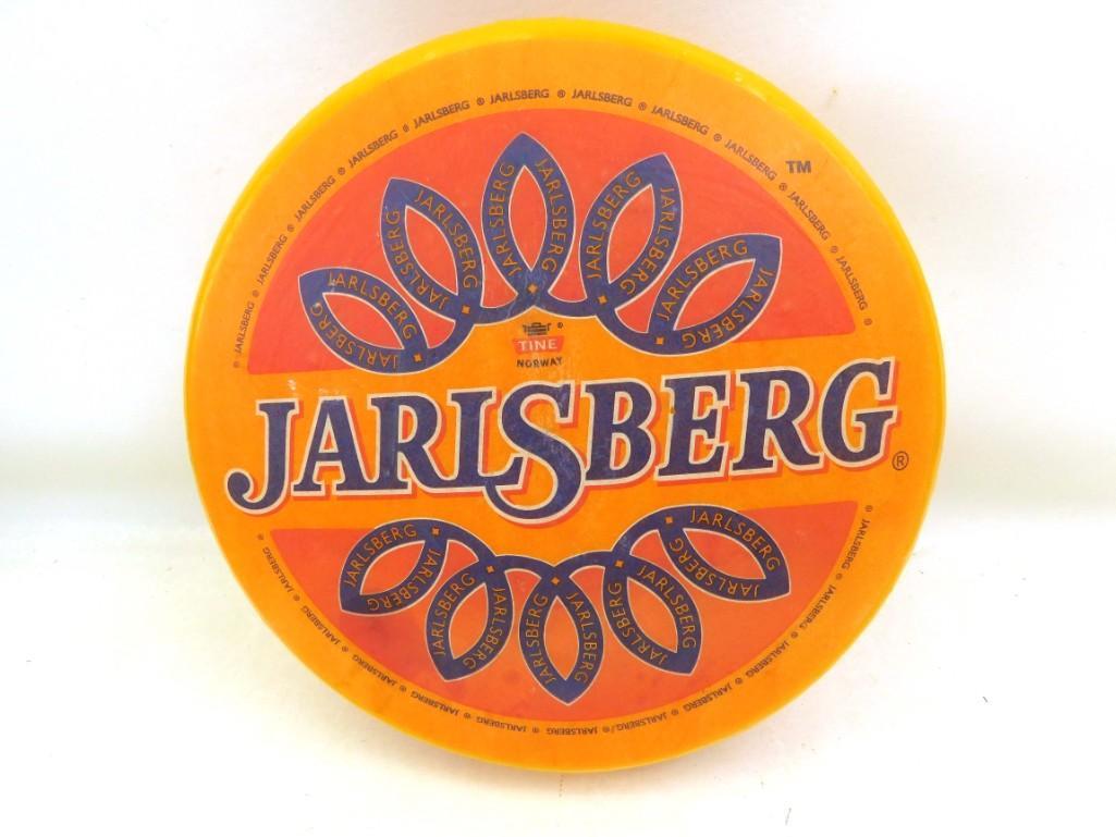 Jarlsberg Cheese Wheel Advertisement: Jarlsberg Cheese Wheel Advertisement This is a large plastic Advertisement for Jarlsberg Cheese. Apparently it's a Norway Brand, but the advertisement was made in Poland Roughly 1 foot in diamet