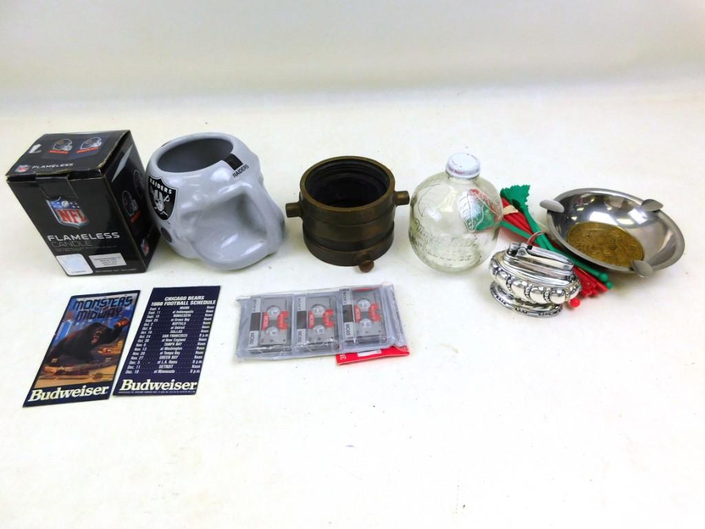 Lots of Goodies NFL Candle, Raiders Helmet Mug Fire: Lots of Goodies NFL Candle, Raiders Helmet Mug Fire hose attachment, glass apple juice bottle, lighter, micro-cassettes, Vintage Ashtray, drink stirrers, etc. The fire hose attachment says W.S. Darley