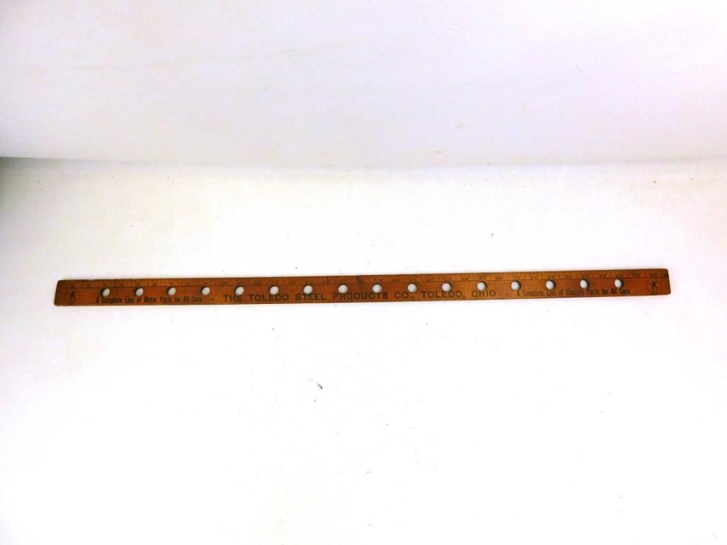 1950: 1950's Advertisement Yardstick One side says The Toledo Steel Products Co The other side has Arlington Auto Parts Arlington Heights 1954Apparently this is used by engine rebuilders to hold the valves 