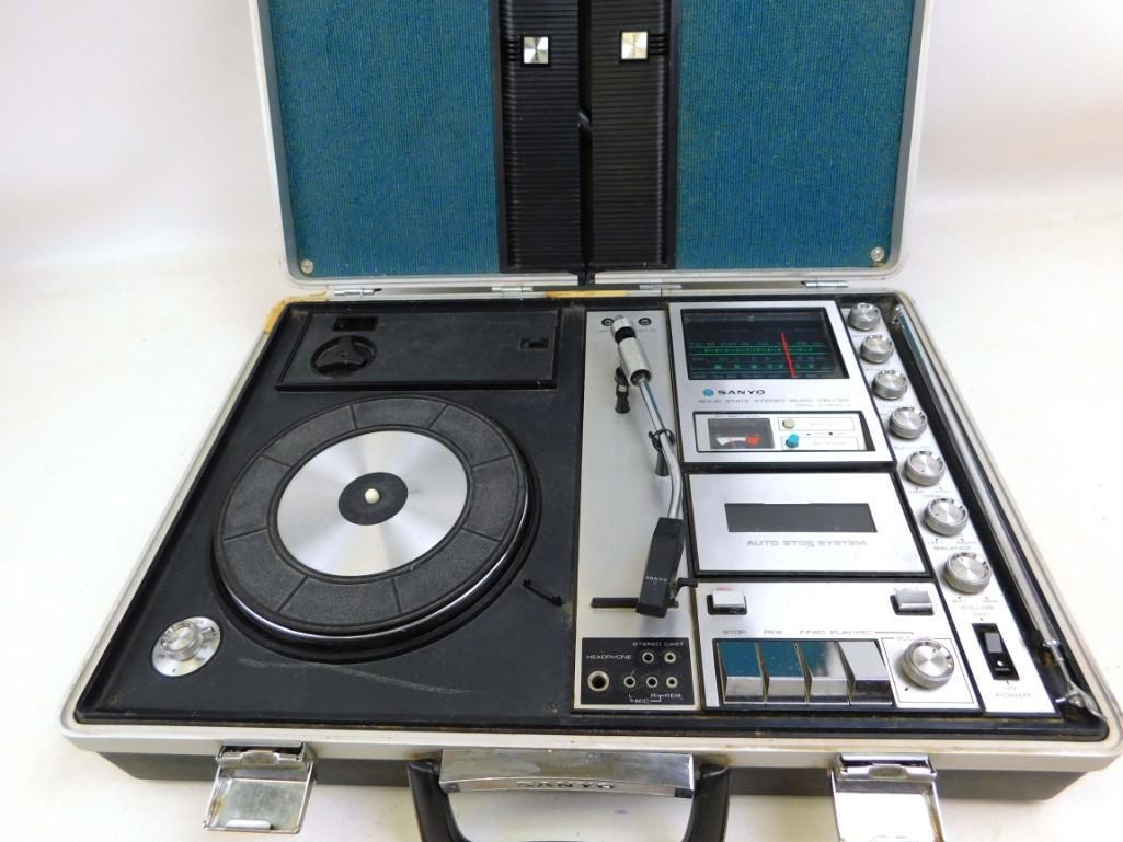 Sanyo Stereo Music Center Model G-2615N from the 1970: Sanyo Stereo Music Center Model G-2615N from the 1970's The speakers detach and it has some microphones. It has radio, record player and cassette player. Power cord is included or it takes batteries.