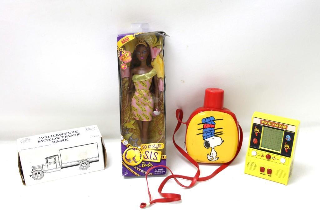 Lot of Toys incl Ertl Truck Bank , So in Style Sis by: Lot of Toys incl Ertl Model 1931 Hawkeye Motor Truck Coin Bank in original box , Kara So in Style Sis by Barbie in original box , Pac Man Game , Snoopy Canteen or Bag