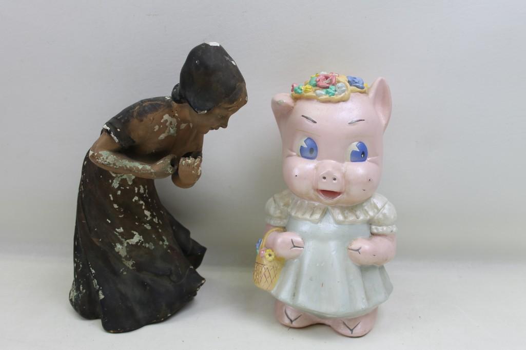 Large Pink Piggy Bank and a Lady Figurine: Large Pink Piggy Bank and a Lady Figurine Both have some wear and tear from over the years.