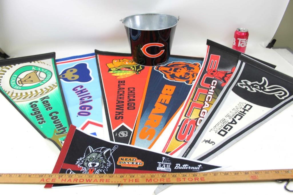Lot of Sports Pennants and a Bucket: Lot of Sports Pennants and a Chicago Bears Bucket . Includes pennants from Chicago Cubs , Chicago Blackhawks , Chicago Bears , Chicago Bulls , Chicago White Sox , Kane County Cougars , etc