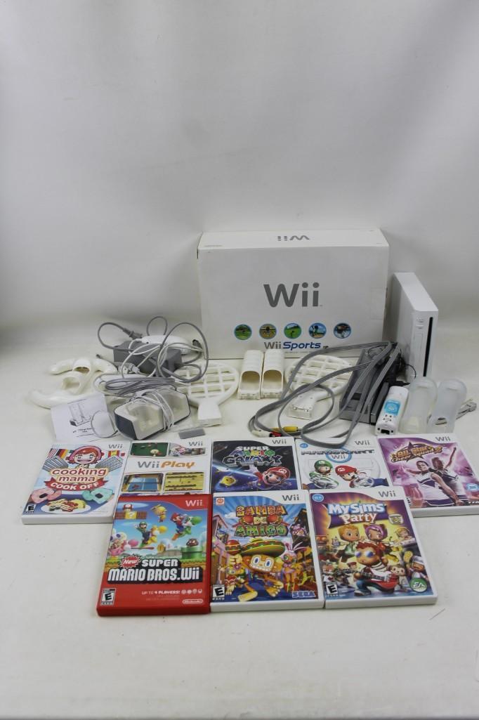Nintendo Wii System with 8 Games and accessories: Nintendo Wii System with 8 Games and accessories Super Mario Bros Wii, Samba De Amigo, My Sims Party, Cooking Mama Cook off, Super Mario Galaxy, Wii Play, Mario Kart Wii, All Star Cheer Squad 2