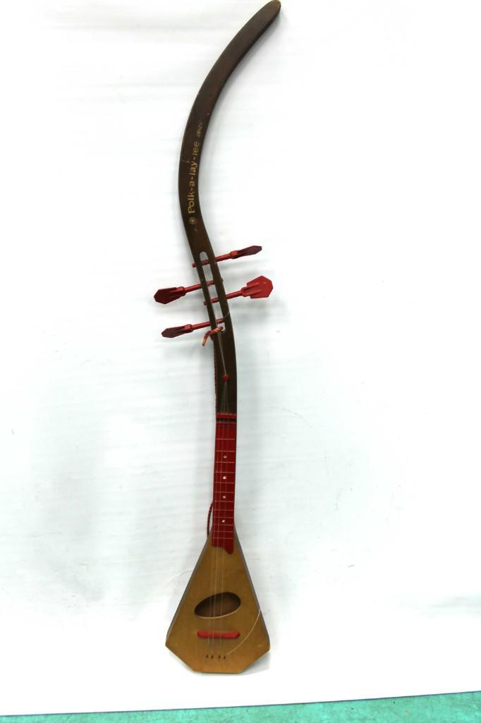 Vintage Polk A Lay Lee Musical Instrument Ukulele: Vintage Polk A Lay Lee Musical Instrument Ukulele . Approx 52" long Condition: Needs to have one string replaced, but if I'm not mistaken, nylon guitar strings should work.