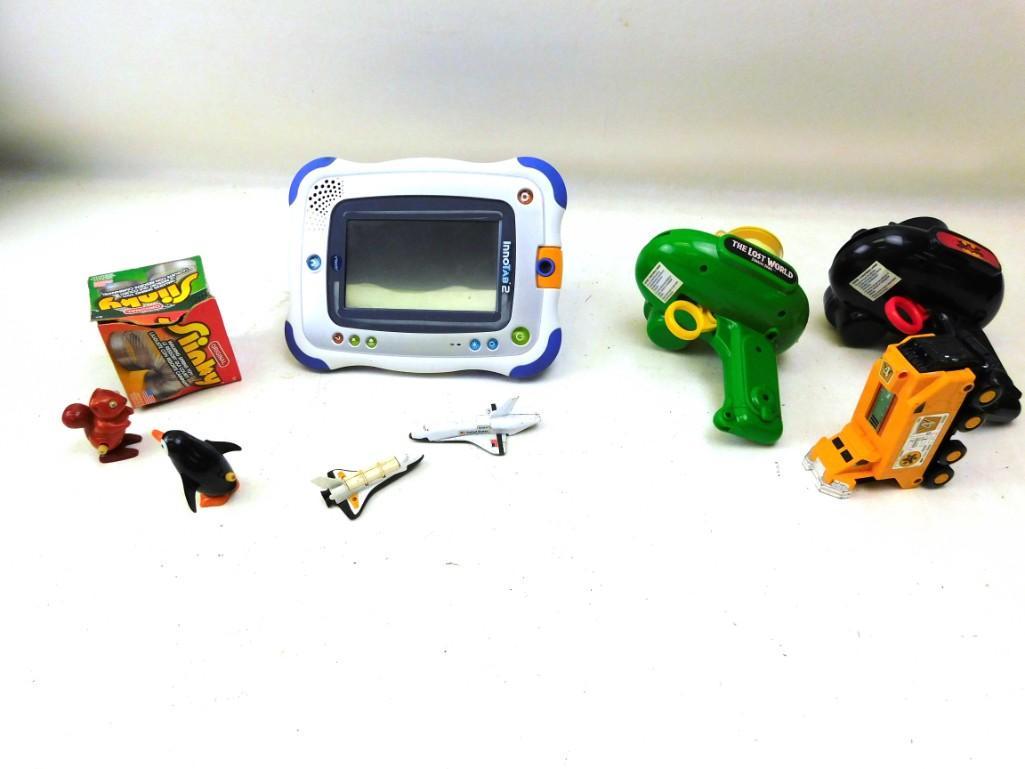 Toy Lot - Slinky InnoTab 2, Batman and Jurassic Park: Toy Lot - Slinky InnoTab 2, Batman and Jurassic Park Disk Guns, Old Windup Squirrel and Penguin, Space Shuttles etc.