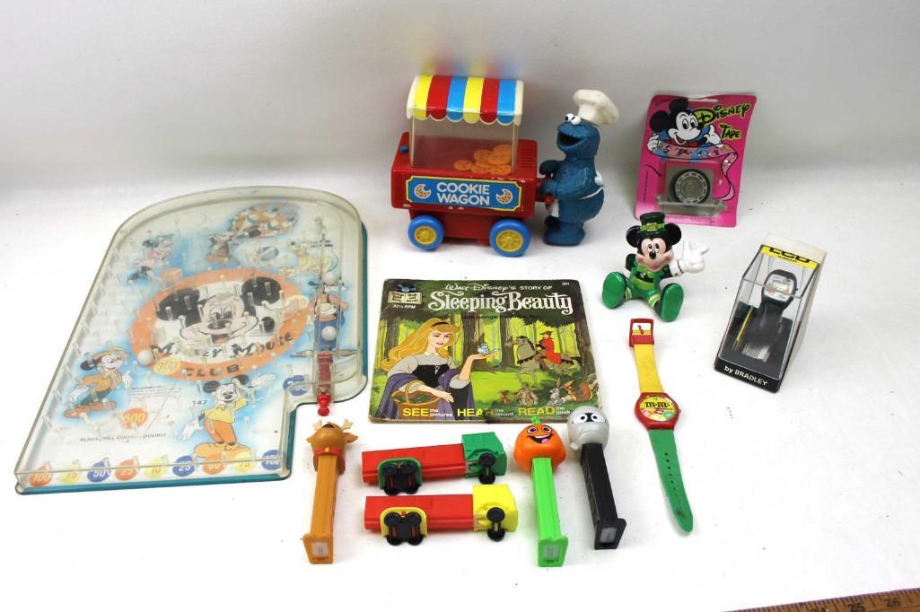 Kids Lot, Mickey Mouse Pinball, Cookie Monster Cookie: Kids Lot, Mickey Mouse Pinball, Cookie Monster Cookie Wagon, Pez, Sleaping Beauty, Mickey Mouse, etc