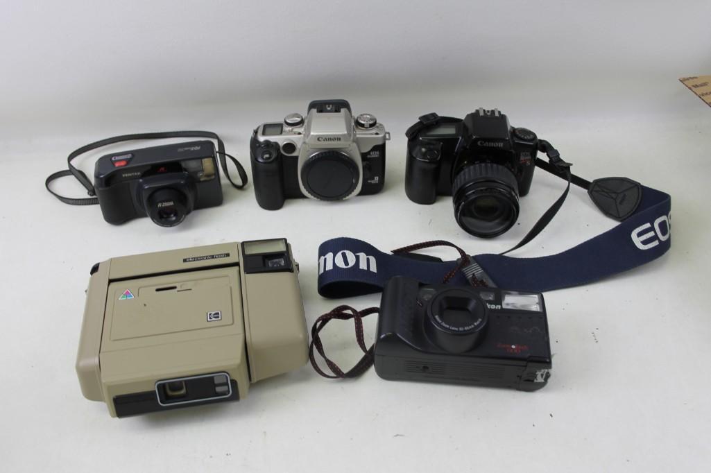 Lot of Vintage Cameras including Canon SLRs, Nikon,: Lot of Vintage Cameras including Canon SLRs, Nikon, Pentax and a Kodak