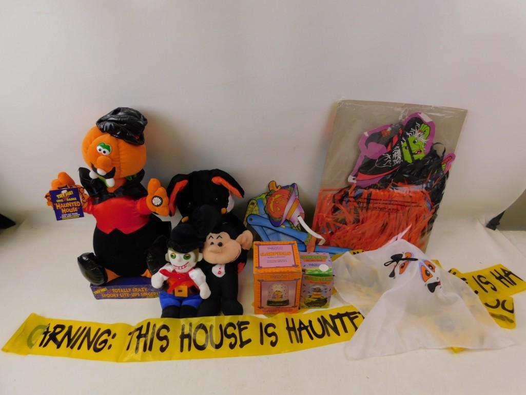 Halloween stuff including Stuffed Animals, Decorations,: Halloween stuff including Stuffed Animals, Decorations, etc. "Warning: This House is Haunted" This a stuffed animal elephant with Halloween colors, a totally crazy spooky pumpkin guy, etc.