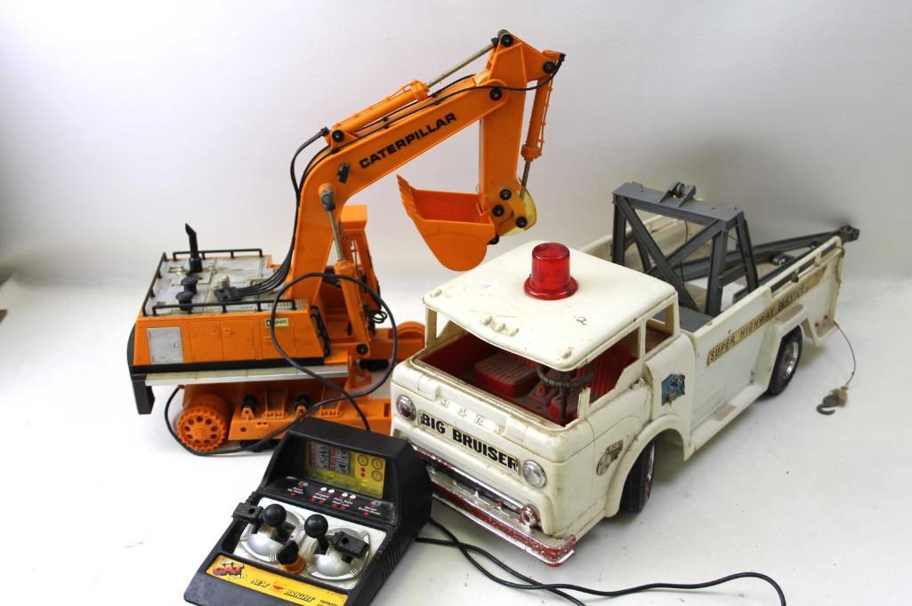 Lot of Vintage Toys for Parts or Repair: Lot of Vintage Toys for Parts or Repair including a Marx Big Bruiser and a Caterpillar Condition: Rough condition with considerable damage