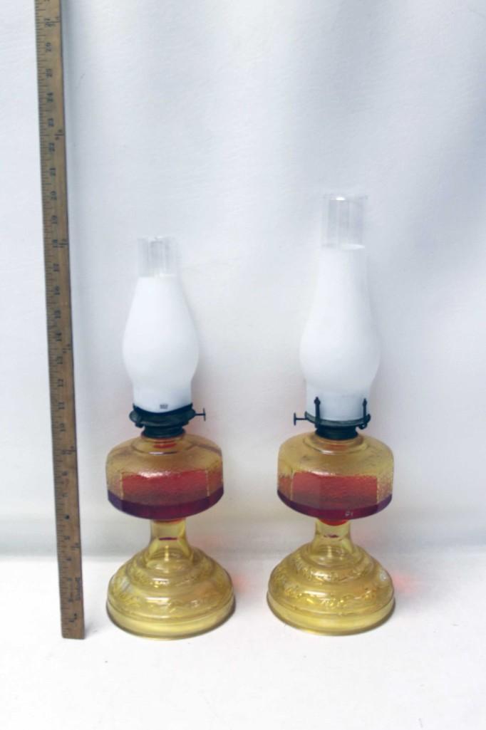 Lot of 2 Antique Oil Lamps: Lot of 2 Antique Oil Lamps These still have red fluid in it. If you want it shipped, the fluid will have to be drained. Speaking of shipping, The UPS Store handles our shipping, so they may be c