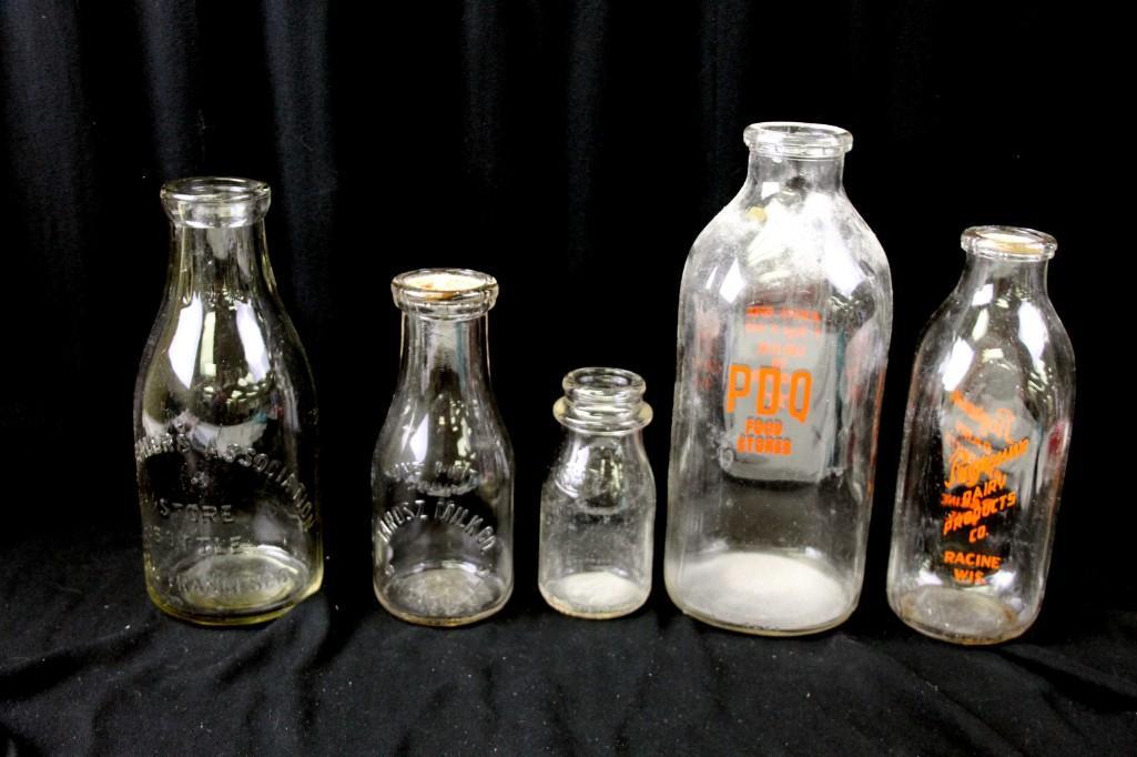 Lot of 5 Vintage Milk Bottles: Lot of 5 Vintage Glass Milk Bottles including Milk Dealers Assoc , Jolosz , Uservo , PDQ Food Stores , and Progressive Dairy Lot H