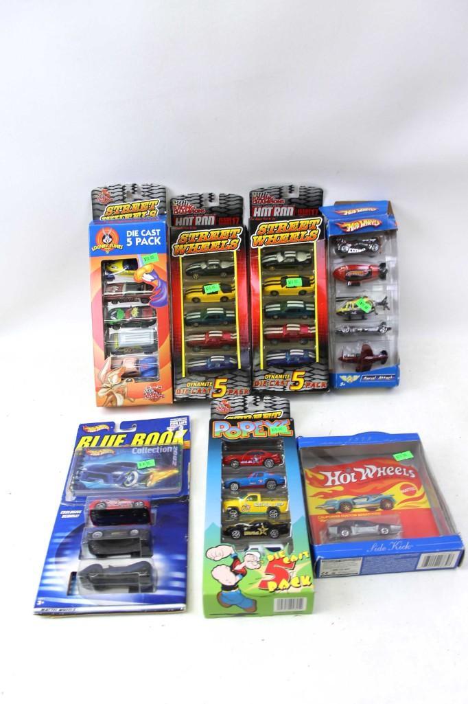 Lot of New Die Cast Cars and Vehicles incl Hot Wheels: Lot of New in Package Die Cast Cars and Vehicles incl Hot Wheels and Racing Champions . Includes Racing Champions Street Wheels Looney Tunes , Racing Champions Hot Rod Street Wheels , Hot Wheels