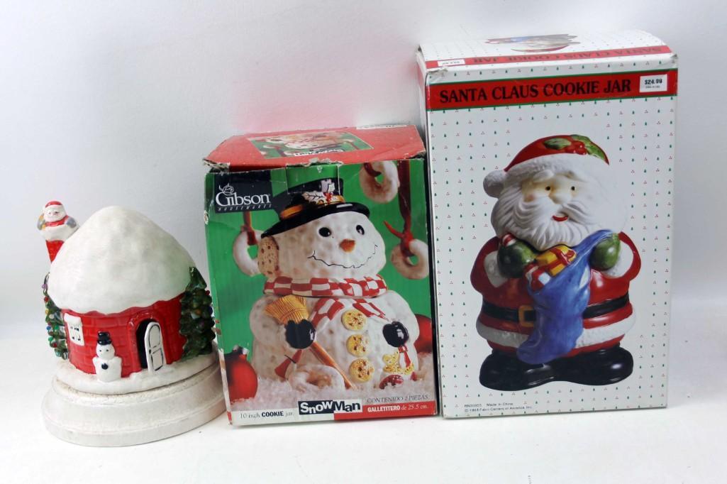 Lot of Christmas incl 2 Cookie Jars and a Christmas: Lot of Christmas decor including a Gibson Snowman Cookie Jar, a Santa Claus Cookie Jar , and a round Christmas house