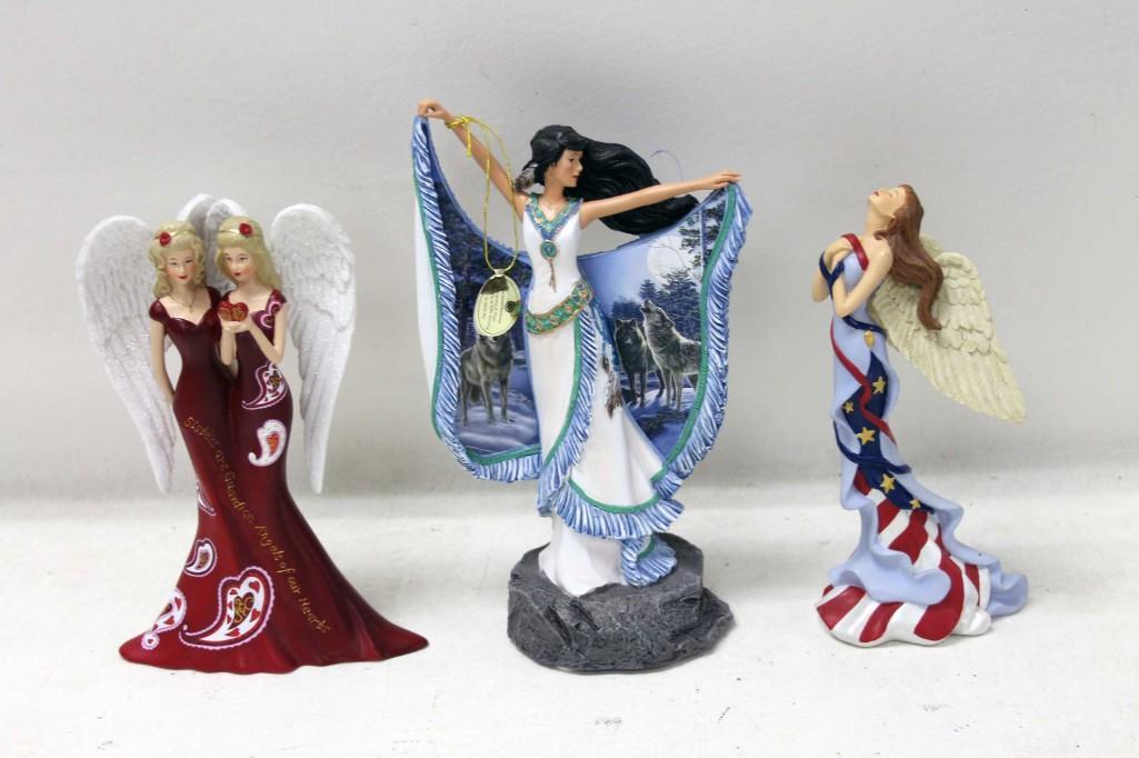 2 Thomas Kinkade Figurines plus Another Figurine: 2 Thomas Kinkade Figurines plus Another Figurine