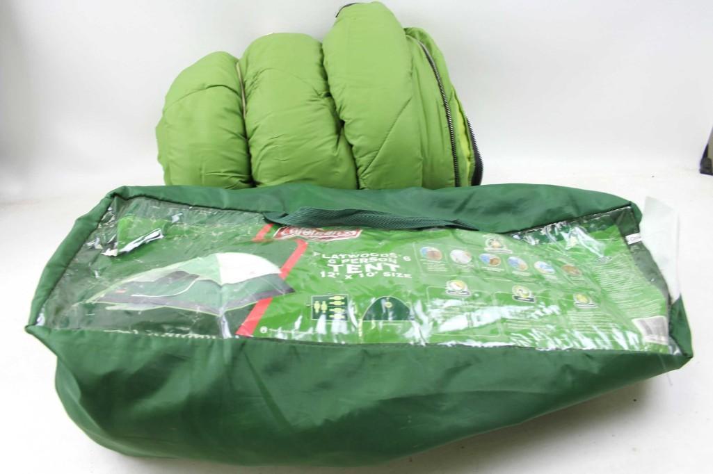 Coleman Flatwoods 6 Person Tent and a Green Sleeping: Camping lot including a Coleman Flatwoods 6 Person Tent 12'x10' and a Green Sleeping Bag Condition: unchecked