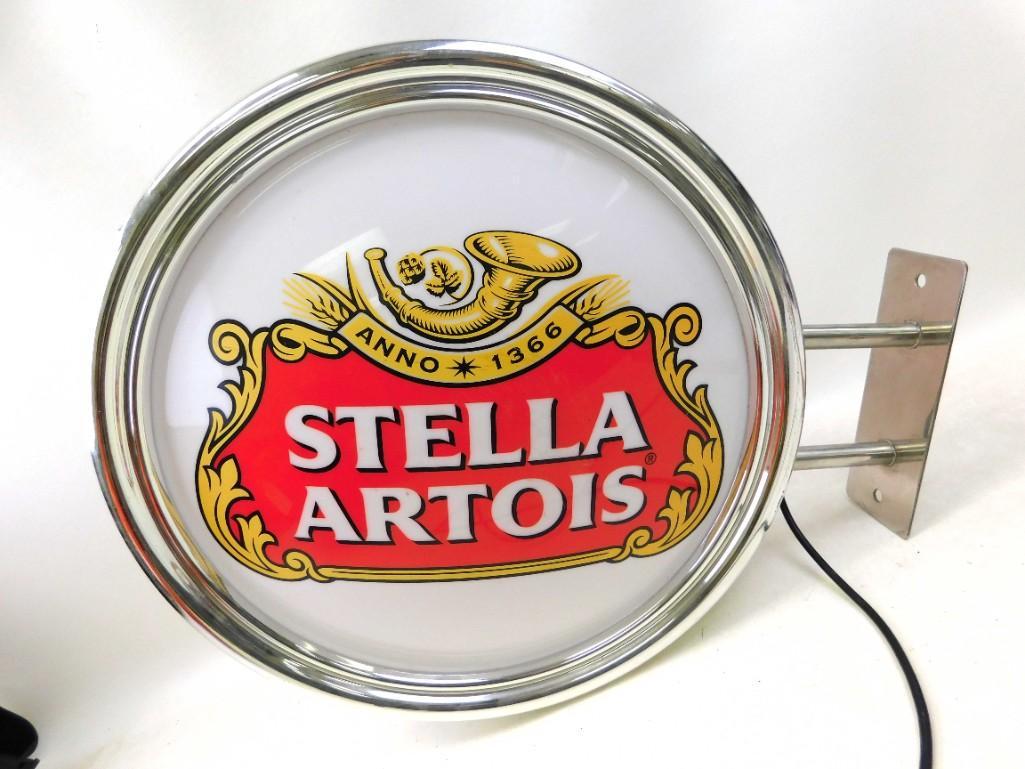 Large Stella Artois Lighted Beer Advertising Sign ,: Large Stella Artois Lighted Beer Advertising Sign , double sided . Works , Sign is plastic, wall mount is metal