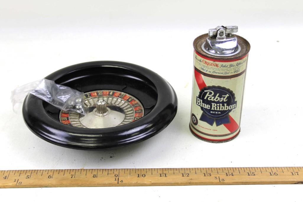 Vintage Pabst Blue Ribbon Table Lighter and a Mini: Vintage Pabst Blue Ribbon Table Lighter and a Mini Roulette Game Condition: Lighter has some rust and wear consistant with age. Please see all pictures