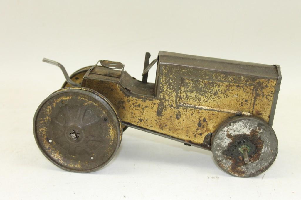 Animate Toys 1910's Tin Tractor - Rough Shape: Animate Toys 1910's Tin Tractor - Rough Shape This one is missing a wheel and is kind of rough shape.