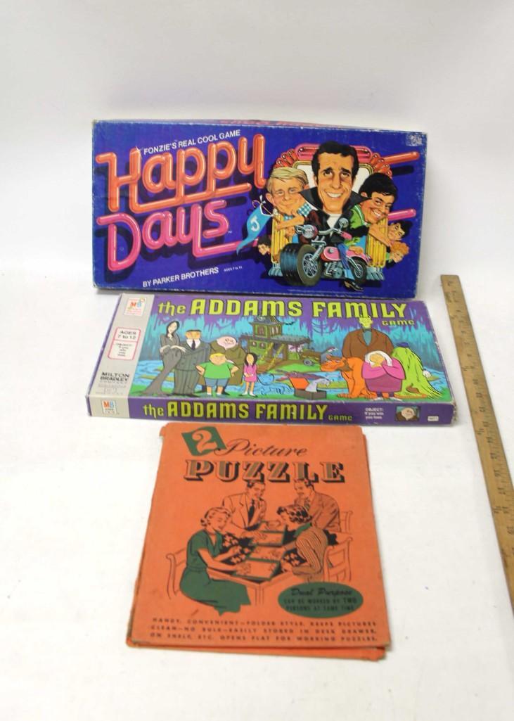 Lot of Vintage Board Games and Puzzles incl Happy Days: Lot of Vintage Board Games and Puzzles incl Happy Days and The Addams Family board games and a 2-Picture Puzzle Condition: Games not checked for completeness