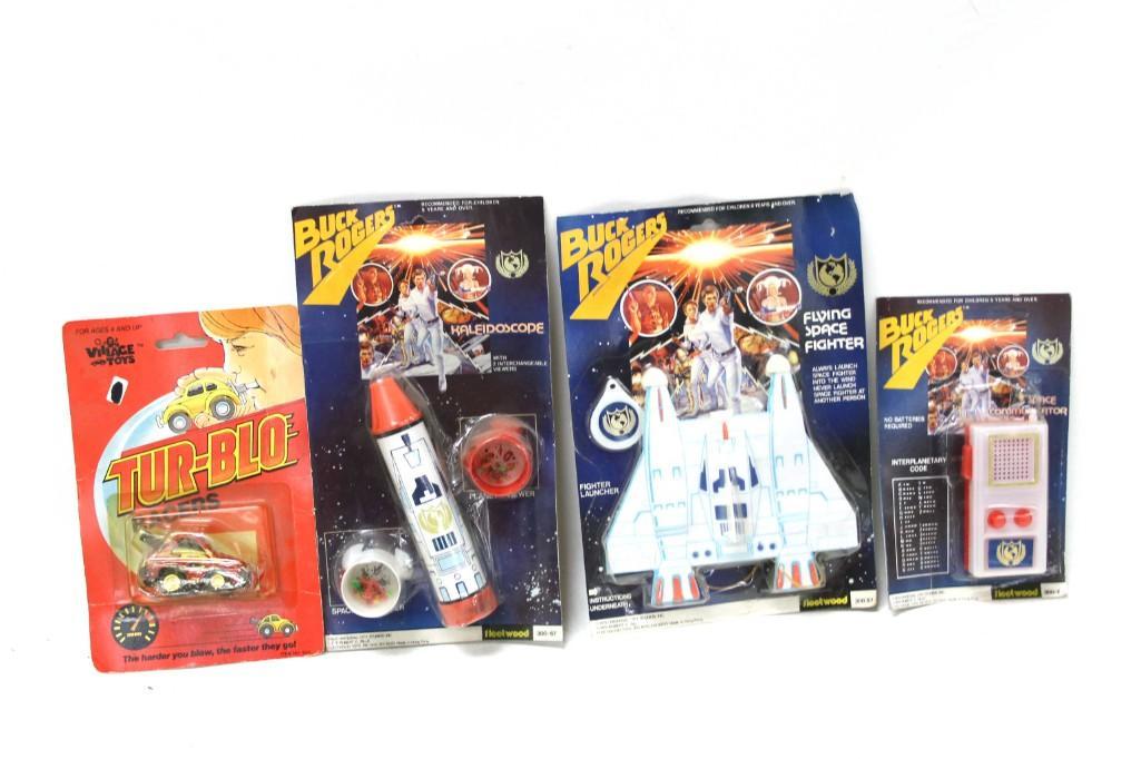 Vintage Toy Lot incl Buck Rogers Toys and a Tur Blo: Vintage toy lot including Buck Rogers Kaleidoscope in original package, Buck Rogers Flying Space Fighter in original package, Buck Rogers Space Communicator in original Package, and a Tur-Blo Racer in