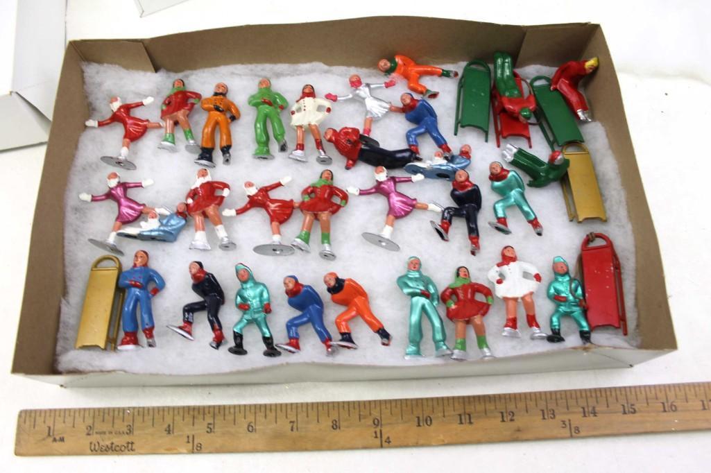 Lot of Vintage Ice Skaters and Sleds: Lot of Vintage Ice Skaters and Sled Figurines Lot A