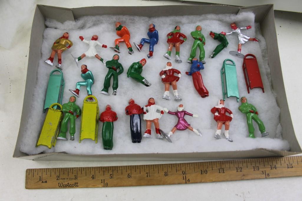 Lot of Vintage Ice Skaters and Sled Figurines: Lot of Vintage Ice Skaters and Sled Figurines Roughly 25 figurines and sleds Lot B