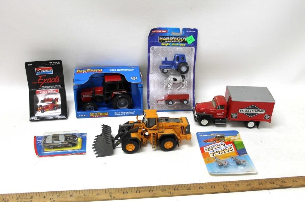 Toy Truck , Tractor , and Vehicle Lot incl Diecast: Toy Truck , Tractor , and Vehicle Lot including Die Cast . Includes a nice Briggs & Stratton truck and a new in box Bit Farm tractor , cars , Micro Force airplanes , toy Volvo front end loa