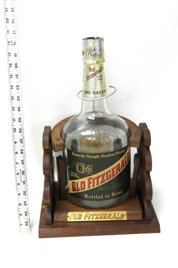 Old Fitzgerald Bottle Cradle Stand or Holder and EMPTY: Vintage Old Fitzgerald Bottle Cradle Stand or Pourer or Holder and EMPTY Bottle Condition: This is missing some of the wire that holds it together to make it able to pour , but it seems like it 
