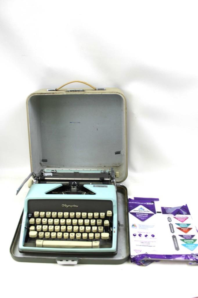Vintage Portable Manual Olympia Typewriter in Aqua: Vintage Portable Manual Olympia Typewriter in Aqua or Teal or Turquoise with a case made in Western Germany