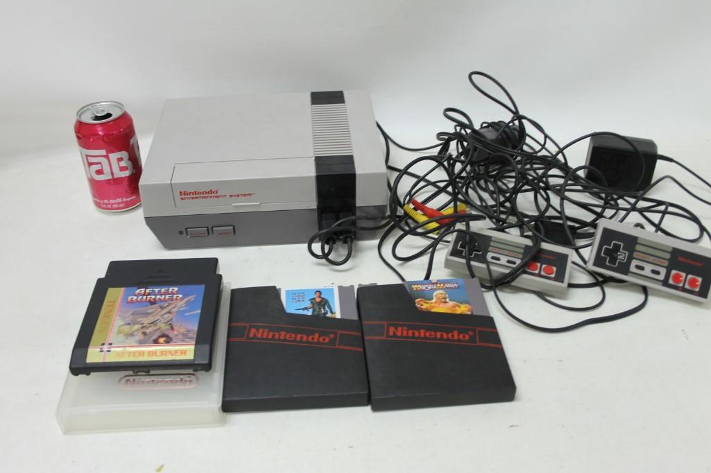 Original Nintendo NES with 3 Games: Original Nintendo NES with 3 Games Includes WrestleMania, Mad Max and Tengen After Burner. Comes with 2 controllers, the AV cords, RF switch and Power Cord