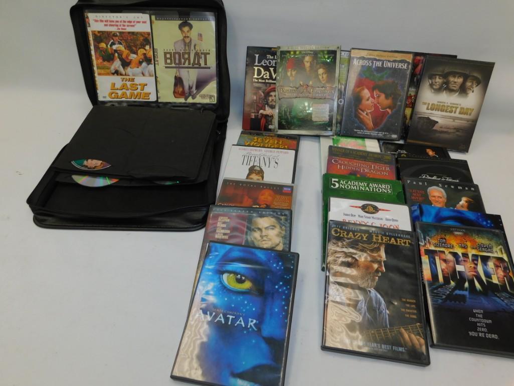 Large Lot of DVD's includes DVD Holder: Large Lot of DVD's includes DVD Holder Borat, The Last Game, Pirates of the Caribbean, DaVinci Code, Breakfast at Tiffany's, Avatar, Crazy Heart, Ticker, The Longest Day, Across the Universe, Crouchin