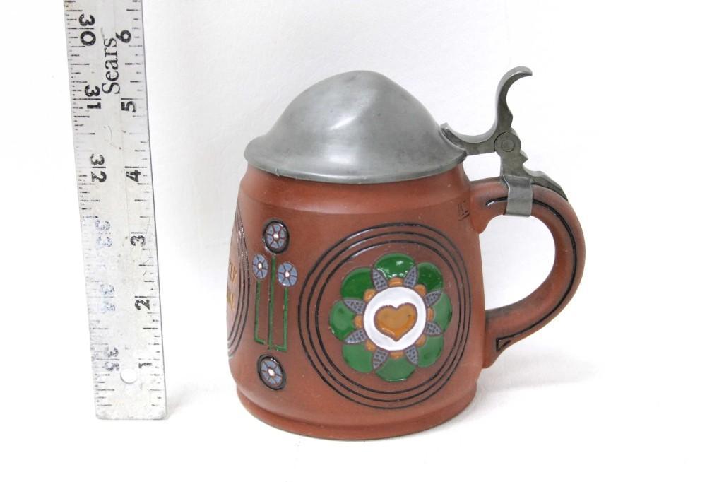DÃ¼mler & Breiden Beer Stein No 1181: Dumler & Breiden Beer Stein #1181 Art Nouveau Floral Design with saying " Bier Macht Heiter Drum Trinke Weiter " Beer Makes You Happy so Drink Some More . Has some dents on the lid Con