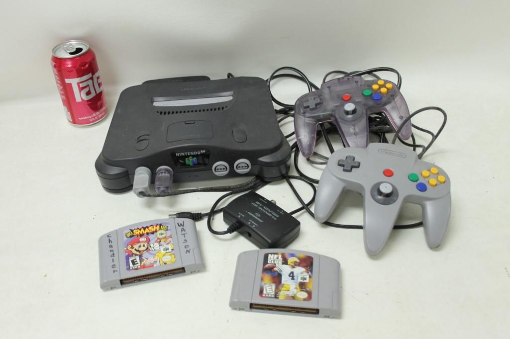 Nintendo 64 Lot including Super Smash Bros. and NFL: Nintendo 64 Lot including Super Smash Bros. and NFL Quarterback Club 99 Comes with RF adapter and 2 controllers. Untested