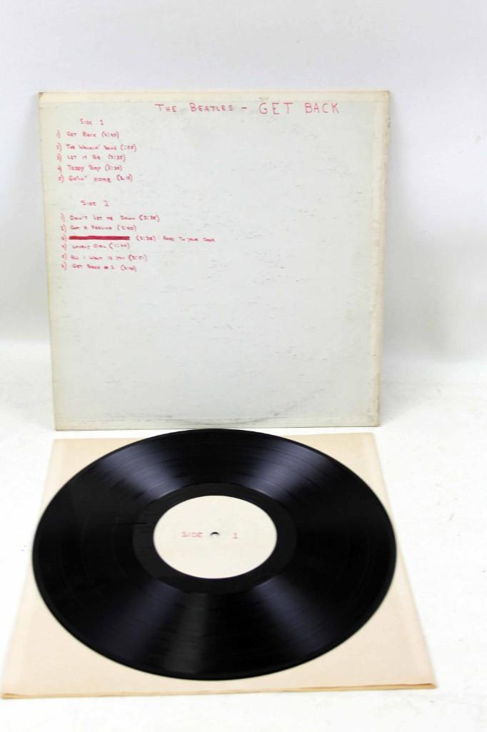 The Beatles Kum Back Bootleg Vinyl LP Album: The Beatles Kum Back Vinyl LP Album The cover has the "Kum Back" stamp in blue ink, the other side appears to be hand written with the songs. Record is in good shape - it just says "side 1" and "Side 