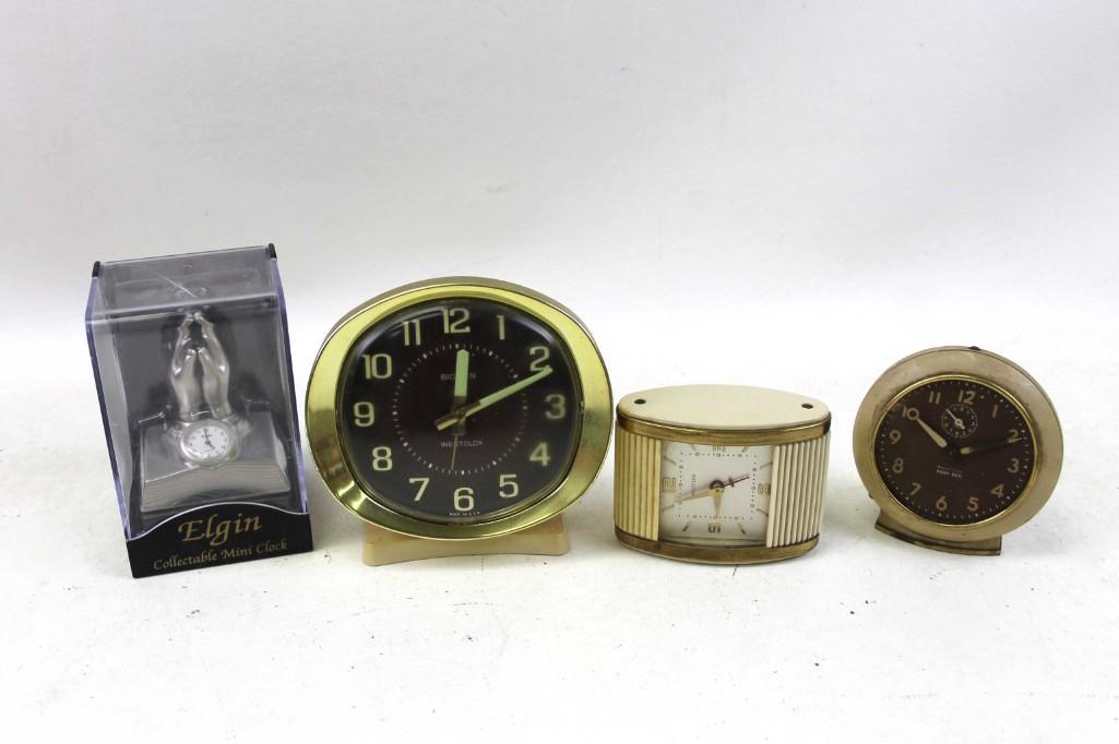 Clock Lot incl 3 Vintage Westclox Clocks plus 1 Elgin: Clock Lot incl 3 Vintage Westclox Clocks, one is bakelite and brass, plus 1 Elgin Mini Clock Condition: Untested
