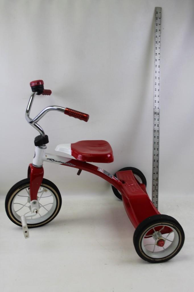 Roadmaster Red Tricycle: Roadmaster Red Tricycle The bell attached has broken plastic piece, so it's tough to get it to ring. Spring will be here before you know it...