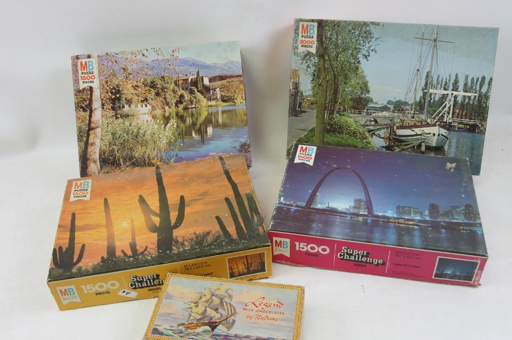 Lot of Milton Bradley Jigsaw Puzzles and a Chocolate: Lot of Milton Bradley Jigsaw Puzzles and a Chocolate Box The chocolate has hopefully been eaten by now.