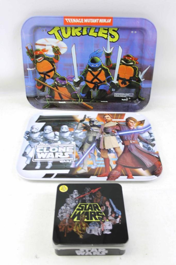 Star Wars and Teenage Mutant Ninja Turtles Lot: Star Wars and Teenage Mutant Ninja Turtles Lot . Includes a metal Star Wars Clone Wars Tray , a Star Wars T Shirt in a Metal Tin (tin has some dents and dings) Shirt is a size M, and a Star Wars