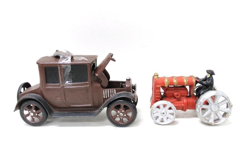 Cast Iron Toy Car and Tractor: Cast Iron Toy Car and Tractor , Car has pieces taped to the top and the hood doesn't close Condition: Car has pieces taped to the top and the hood doesn't close