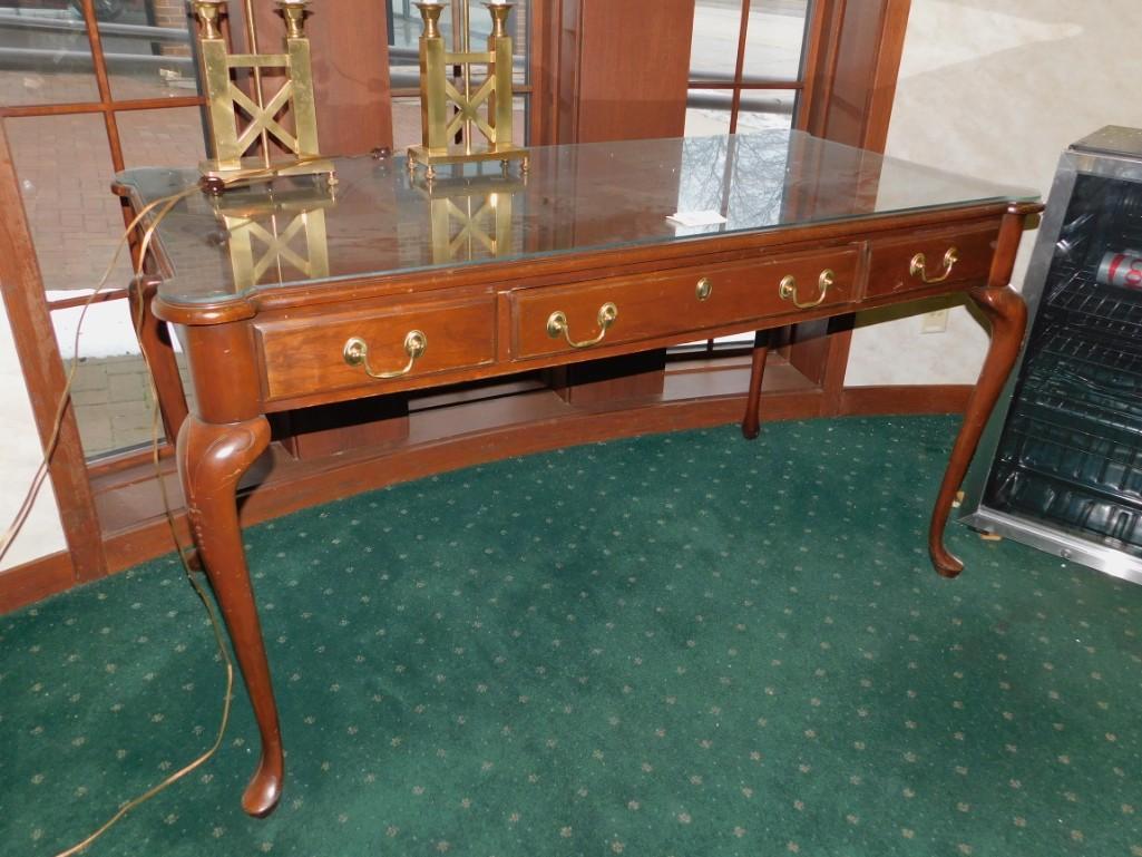 Hardin Wood Desk w Glass Top: Hardin Wooden Desk or Hall Table or Sofa Table glass top 54"x28" , Queen Anne style legs Because of the current covid 19 situation, pick up times are by appointment only. Pick up for this auction will