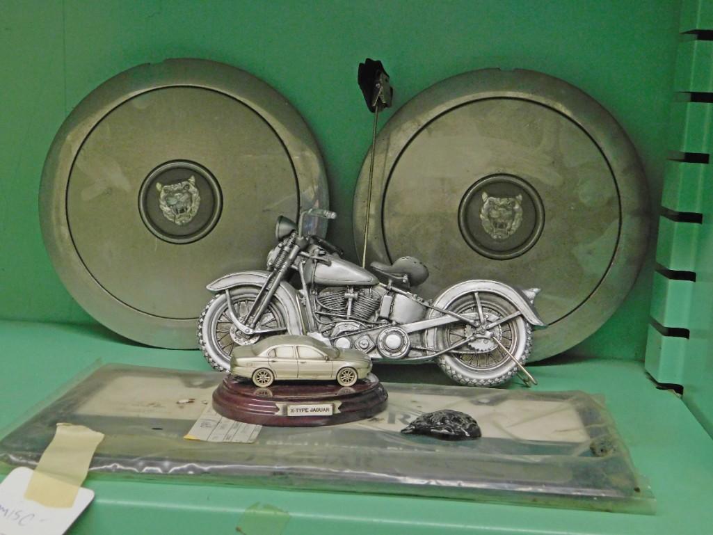 Misc lot incl Jaguar Hubcaps , Motor Cycle & Jaguar: Misc lot incl Jaguar Hubcaps , Motor Cycle & Jaguar Miniature Replicas . License Plate Holder , etc Because of the current covid 19 situation, pick up times are by appointment only. Pick up for this a