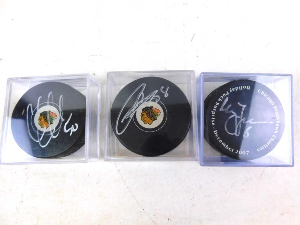 Lot of 3 Signed Hockey Pucks: Lot of 3 Signed Hockey Pucks - Corey Crawford, Patrick Kane and Magnus Johansson
