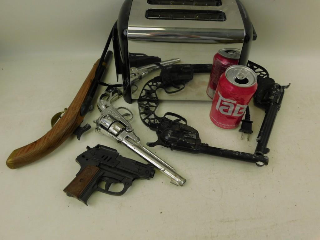 Vintage Toy Guns and a Tactical Bread Browning System: Vintage Toy Guns and a Tactical Bread Browning System that runs on alternating current...a toaster