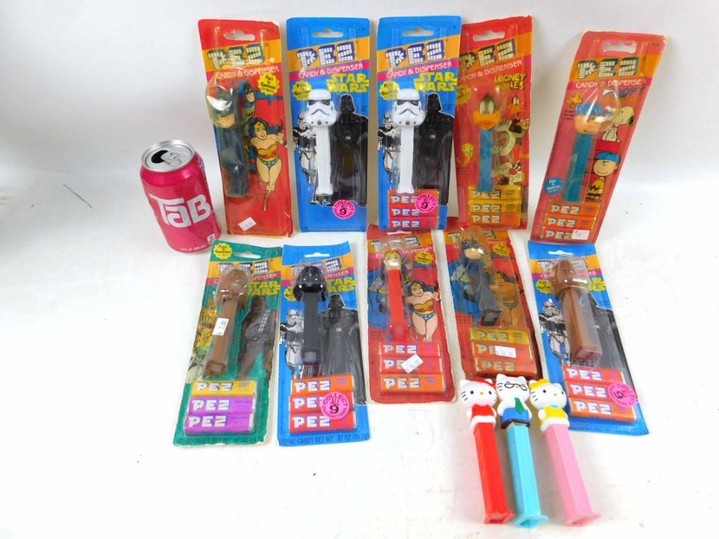 Lot of 13 or so Vintage Pez Dispensers including Hello: Lot of 13 or so Vintage Pez Dispensers including Hello Kitty, Star Wars, Batman, Wonder Woman, Daffy Duck, Charley Brown, etc. Most are still in package