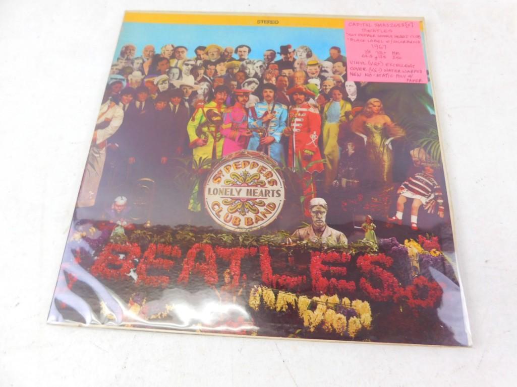The Beatles Sgt. Peppers Lonely Hearts Club Band Vinyl: The Beatles Sgt. Peppers Lonely Hearts Club Band Vinyl LP Record. See attached Tag for More Information